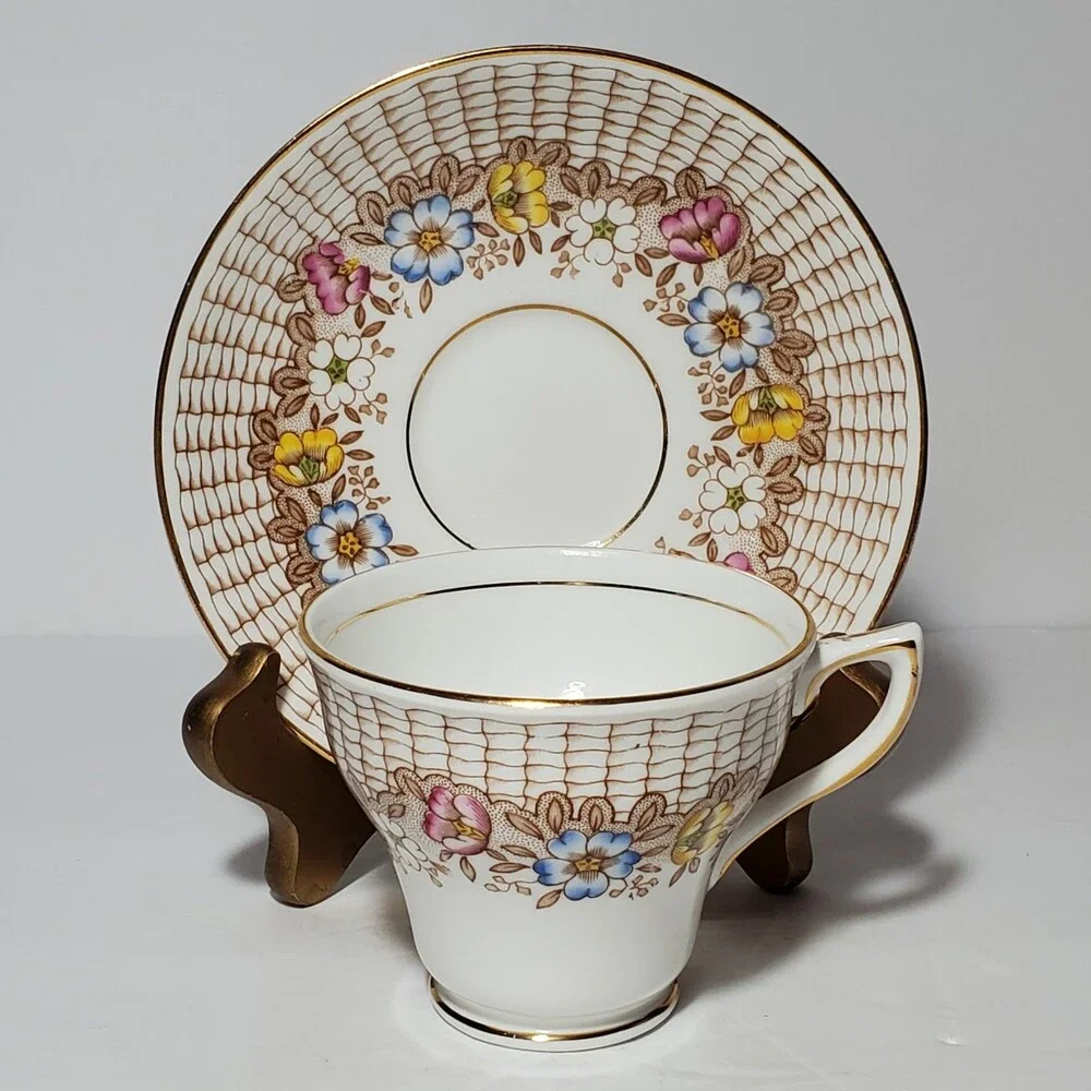 Rosina Teacup and Saucer Floral Basket Weave Pink Blue Flowers Vintage